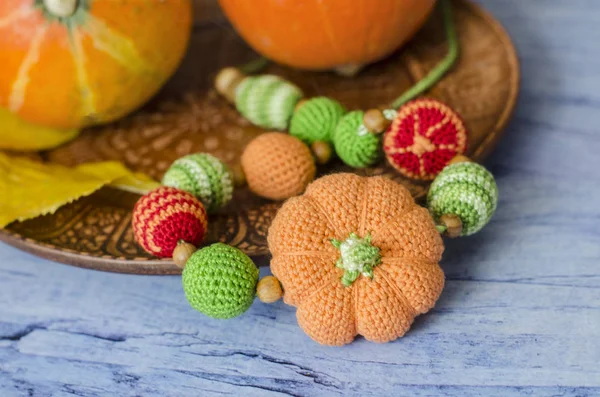 Necklace Made Knitted Beads Child Sitting Sling Composition Decorative Pumpkins — Stock Photo, Image