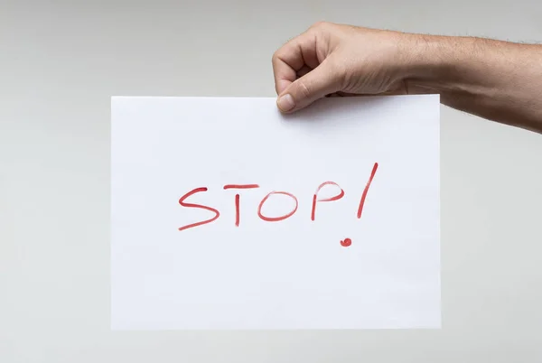 Λέξη Stop Ένα Λευκό Φύλλο Χαρτί — Φωτογραφία Αρχείου