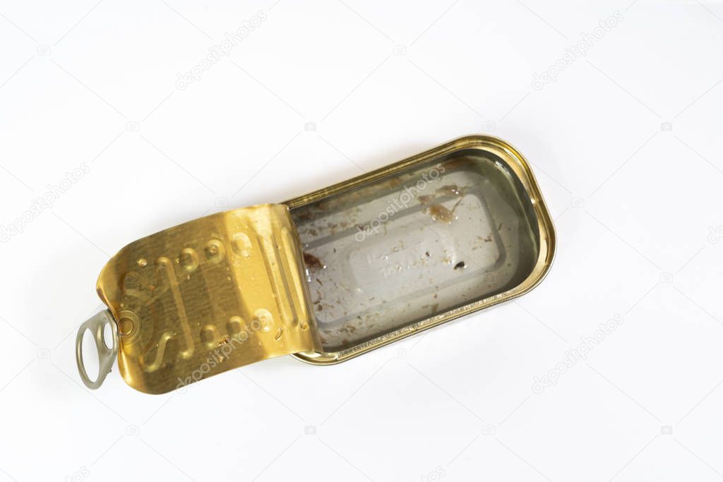 an empty tin of fish in oil