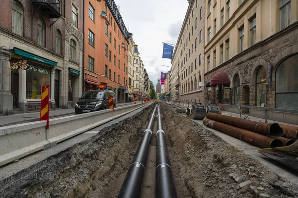 Laying pipes in a street in Stockholm — Stock Photo, Image