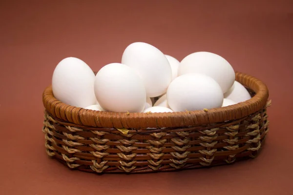 Wicker Basket Eggs Brown Background — Stock Photo, Image