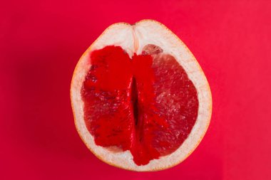 top view half of fresh ripe grapefruit with red paint clipart