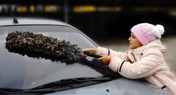 Woman Deicing Side Car Windshield With Scraper Stock Photo