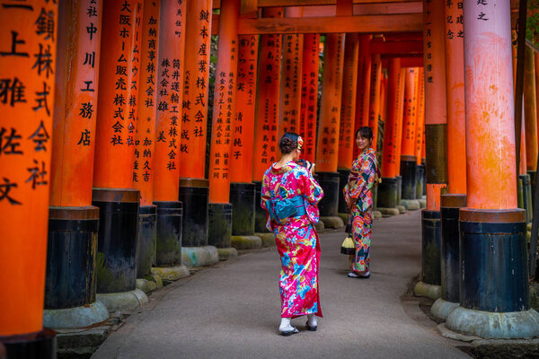 Ladies wear yukata on walkway of Fushimi Inari shrine
