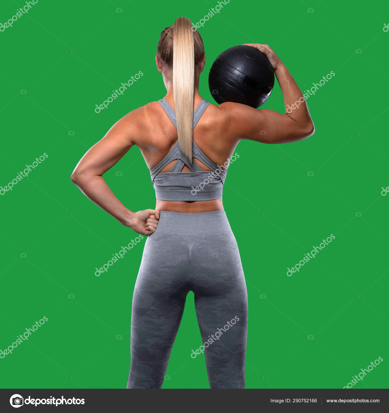 Strong Confident Power Stance Female Trainer Medicine Ball Toned Buttocks  Stock Photo by ©elnariz 290752166