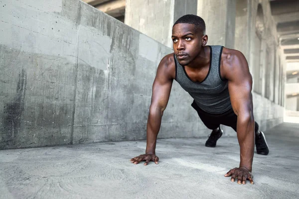 African american male athlete, city urban training, fitness push ups on concrete with copy space