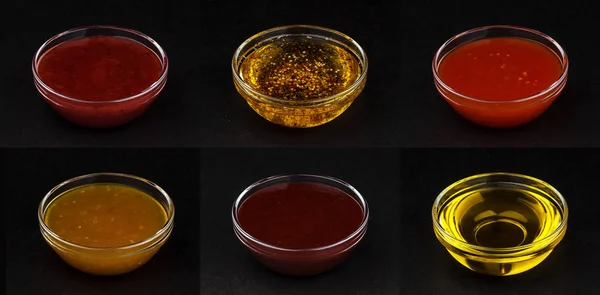 Différentes sauces isolées sur fond noir — Photo