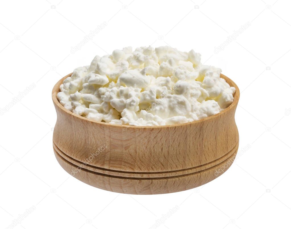 Wooden bowl of cottage cheese isolated on white background, top view