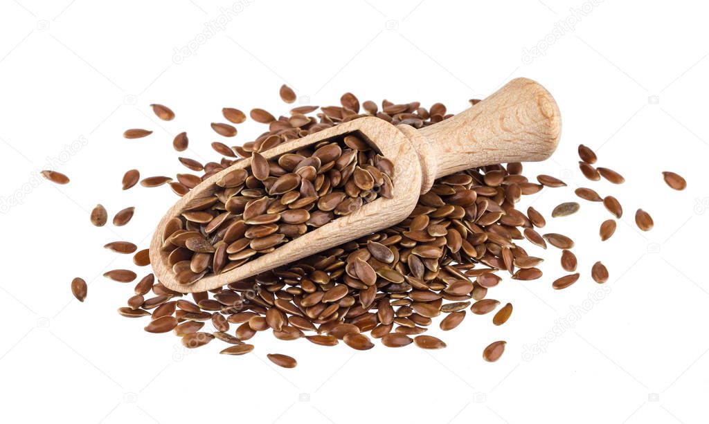 Pile of flax seeds isolated on white background, close-up of flaxseed in wooden scoop