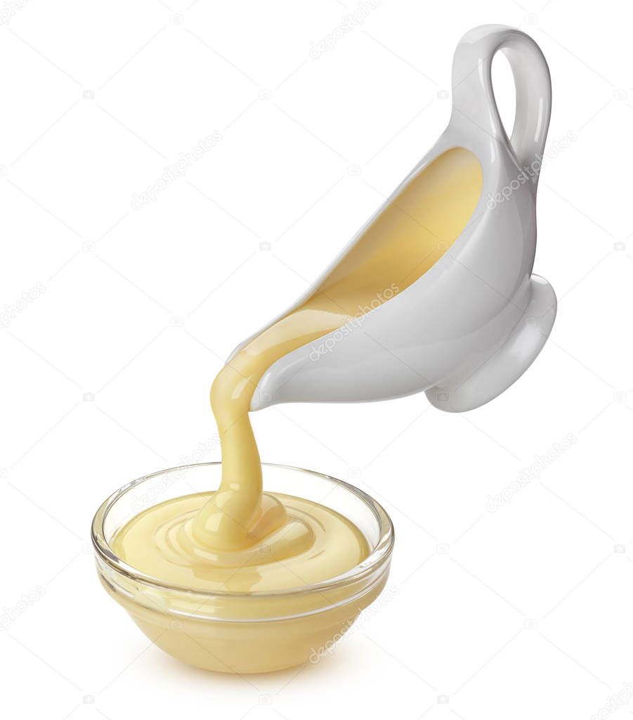 Pouring condensed milk isolated on white background