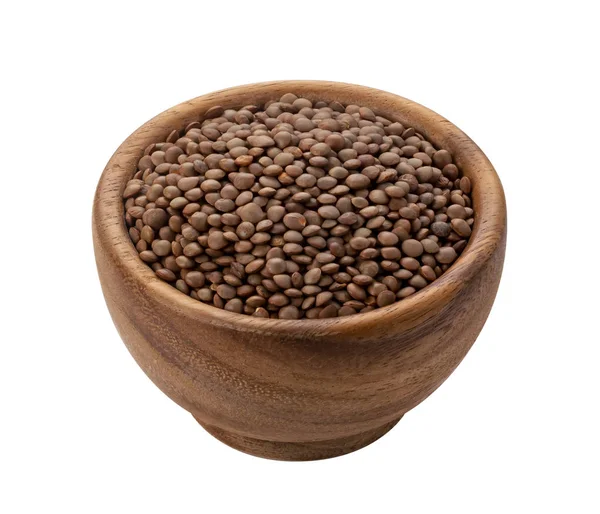 Brown lentils in wooden bowl isolated on white background — Stock Photo, Image