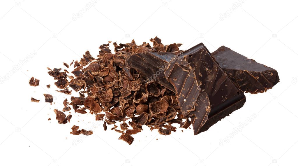 Broken chocolate. Heap of ground and grated chocolate isolated on white background