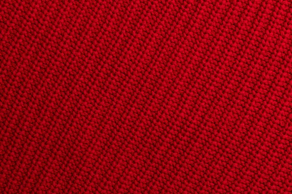 Röd stickad ull tyg bakgrund — Stockfoto