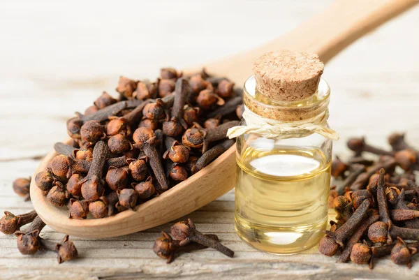 Clove Essential Oil Glass Bottle Wooden Table — Stock Photo, Image