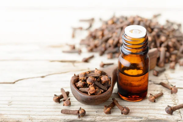 Clove Essential Oil Glass Bottle Wooden Table — Stock Photo, Image