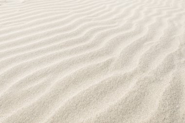 Natural background of beige sand texture. clipart