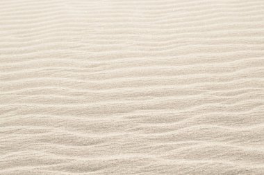 Natural background of beige sand texture. clipart