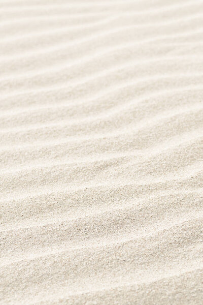 Natural background of beige sand texture.