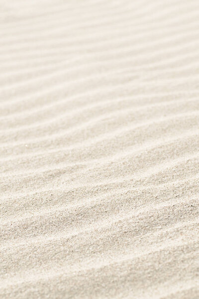 Natural background of beige sand texture.