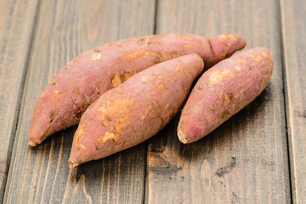 Red Sweet Potatoes Wooden Board — Stock Photo, Image