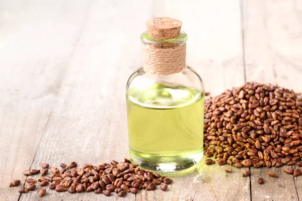 grape seed oil and grape seeds on the table