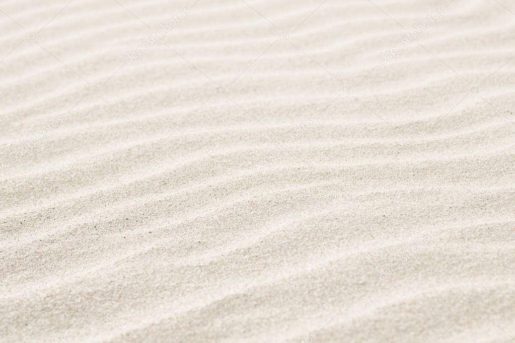 Natural background of beige sand texture.