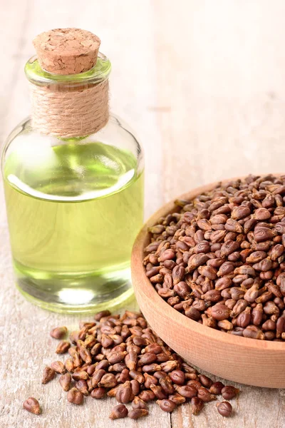 grape seed oil and grape seeds on the table