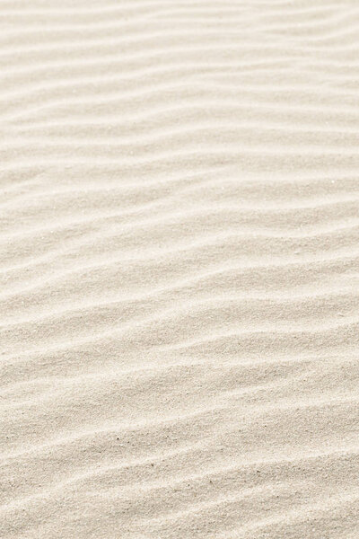 Natural background of beige sand texture.