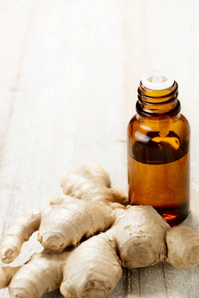 Ginger essential oil in the amber bottle