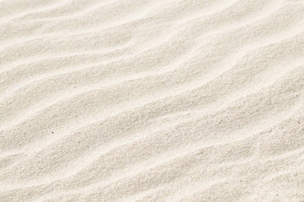 Natural background of beige sand texture.