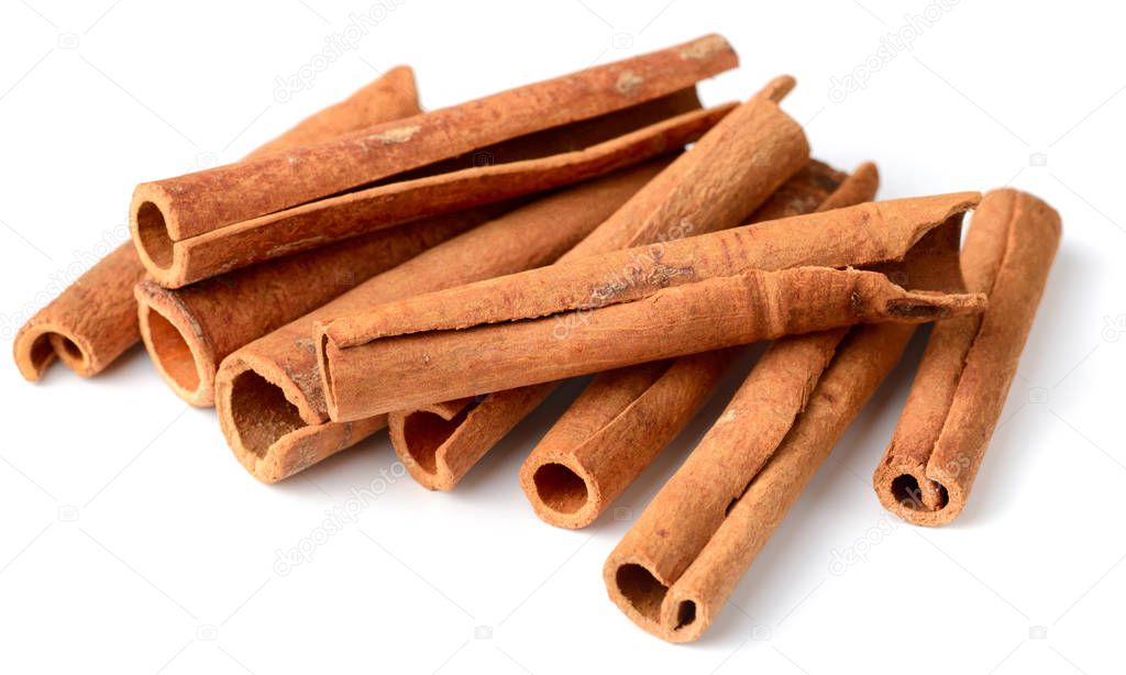 close up of cinnamon sticks isolated on white background