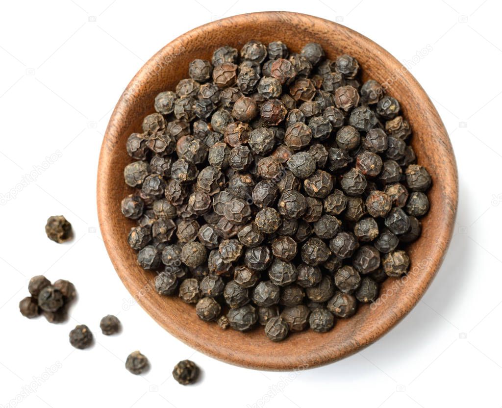 dried black peppercorns isolated on the white background