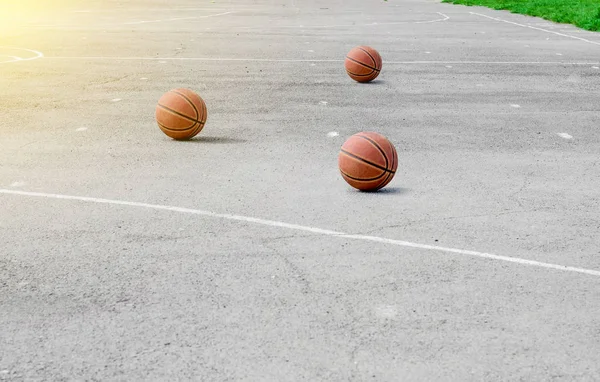 ball for playing basketball lies on the sports ground