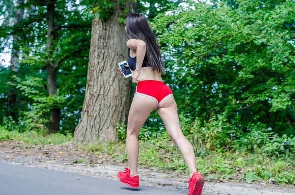 Las Caderas Una Chica Piernas Delgadas Pantalones Cortos Rojos Bragas — Foto de Stock