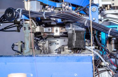 Örgü çorap yapmak için makine. Konu, parçalar, giyim üretimi.