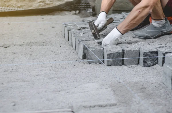 Worker Lays Gray Granite Pavement Tiles Marked Site Arrangement Urban — Stock Photo, Image