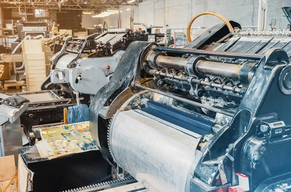 Old vintage printing machine for cutting cardboard in the printi