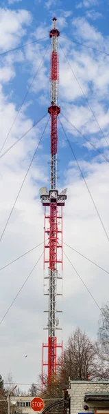 Large television relay tower against the background of the sky.