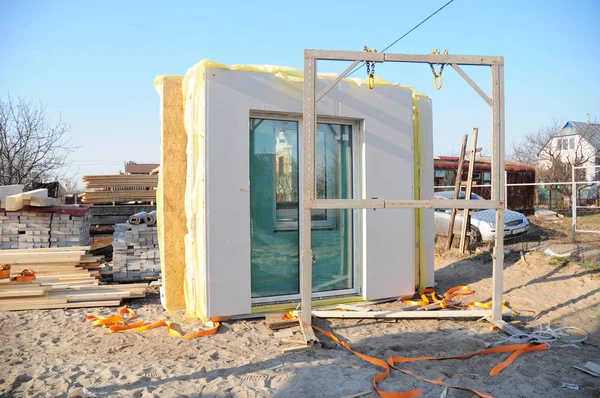 Modular frame plywood board panel walls house on the home construction site. Structural insulated panels house installation.