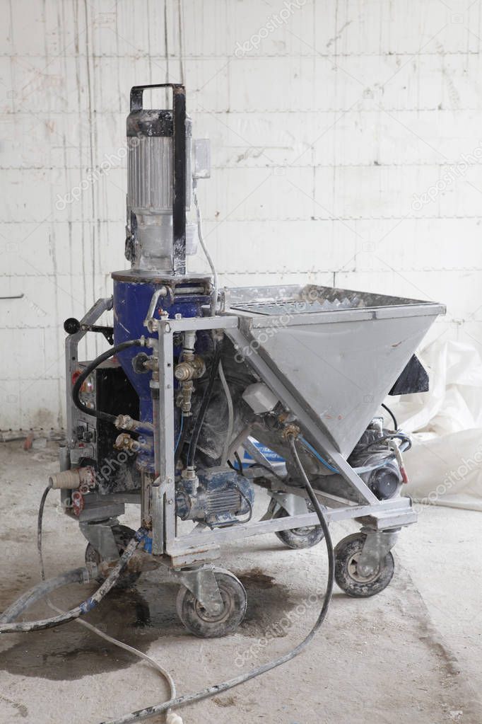 Plastering machine for house plastering walls. Electric Spray Plaster Machine. Automatic cement wall screeding plaster machine.