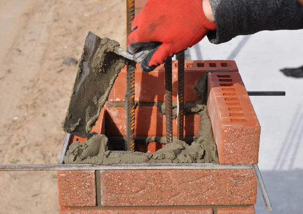 Bricklayer Hand Laying Brick Column Metal Rod — Stock Photo, Image