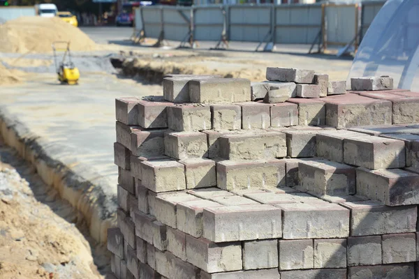 Road construction. Pile of pavement against road construction.