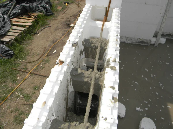 Insulating concrete forms ICF  with reinforced concrete house walls. Insulating concrete forms ICF made of plastic foam that construction crews stack into the shape of the walls of a building.