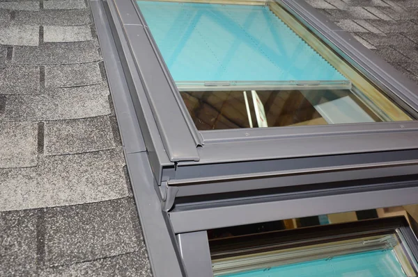 Skylight window waterproofing installation details on house asphalt shingles rooftop. Roofing construction and attic skylight window waterproofing. — Stock Photo, Image