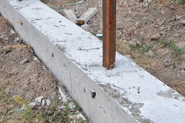 Building concrete foundation for new fence. House concrete fencing construction — Stock Photo, Image