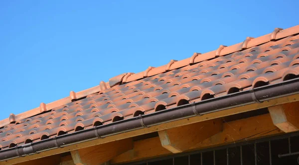 Clay rooftop with rain gutter pipeline — Stock Photo, Image