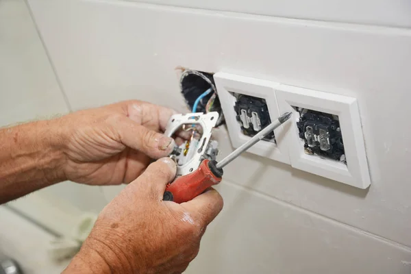 Electrican repair and installing socket, outlet plug