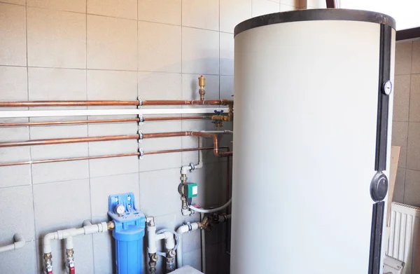 House boiler room with copper pipeline and water filtration system — Stock Photo, Image