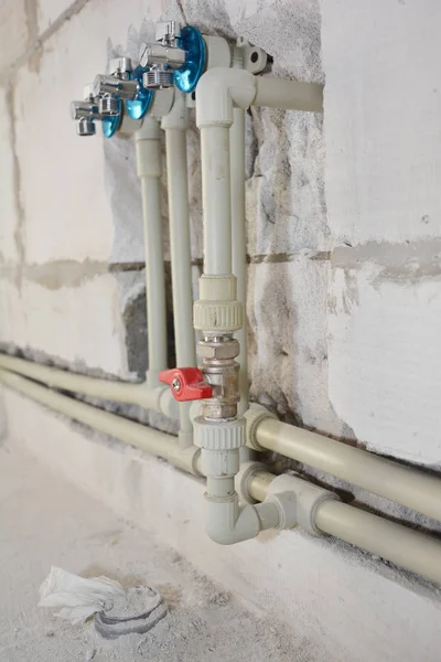 Installing and hide in wall water pipes in the house bath room. Groove or trench cut for water pipes in the wall — Stock Photo, Image