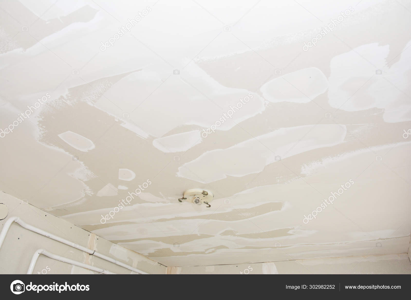 Skim A Ceiling Plaster A Ceiling With Plastering Stock